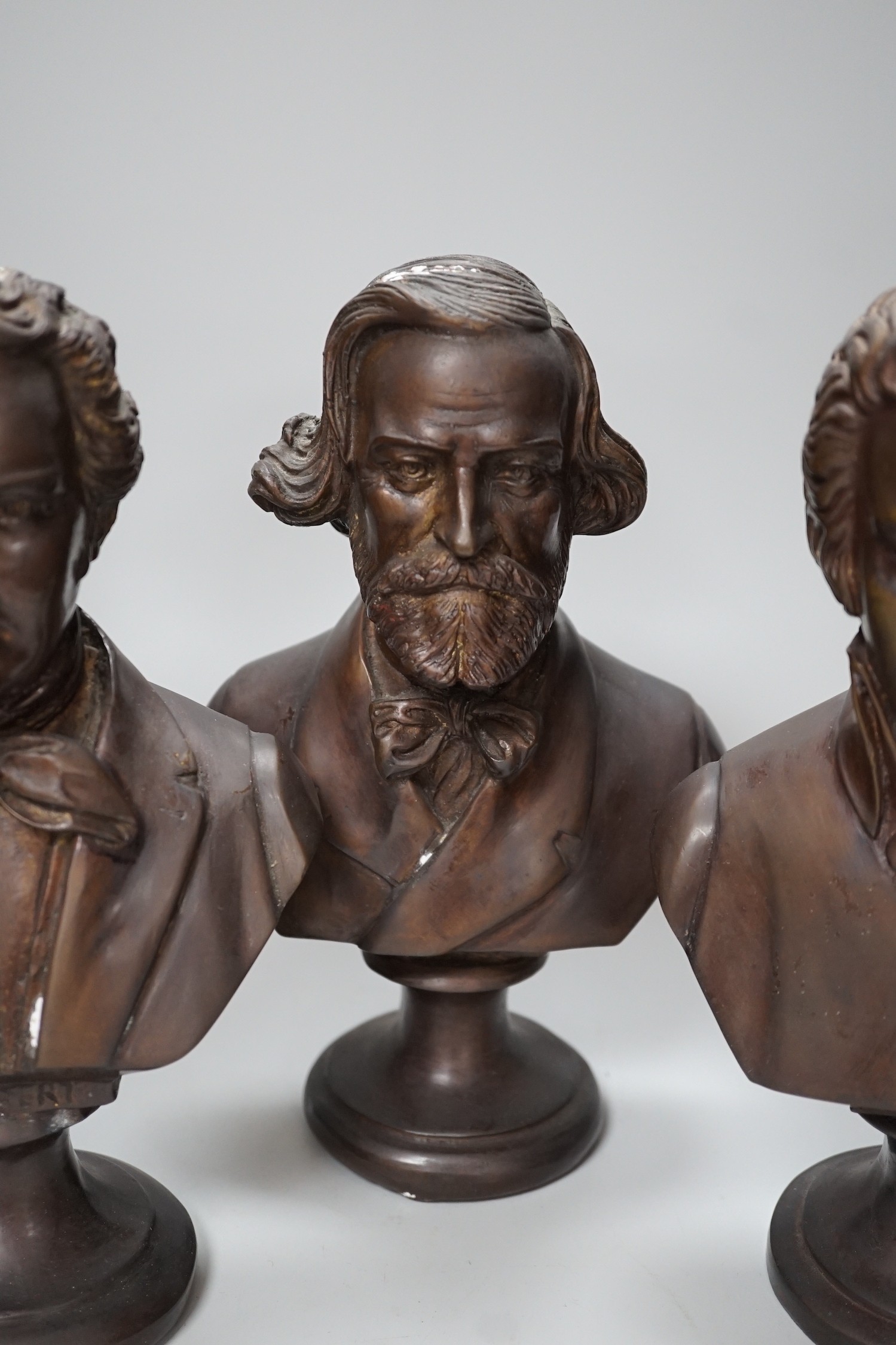 A set of four bronze covered busts of composers: Schubert, Wagner, Verdi and Mozart, 14cm high